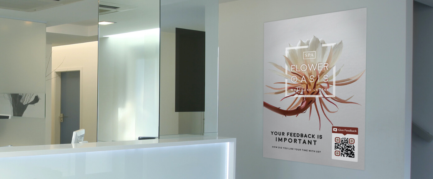 A poster in a wellness center with a QR Code lets customers leave detailed feedback when scanned.